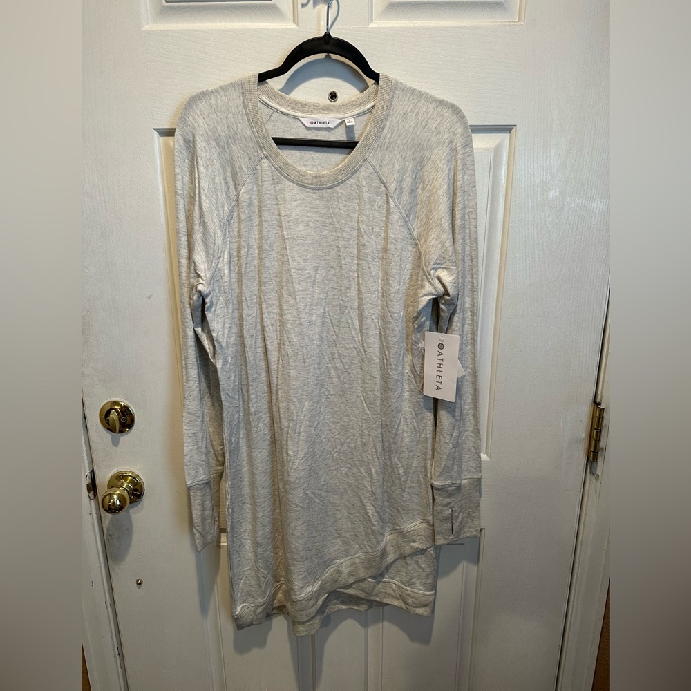 Grey Athleta tunic style sweater with cross bottom and thumb holes